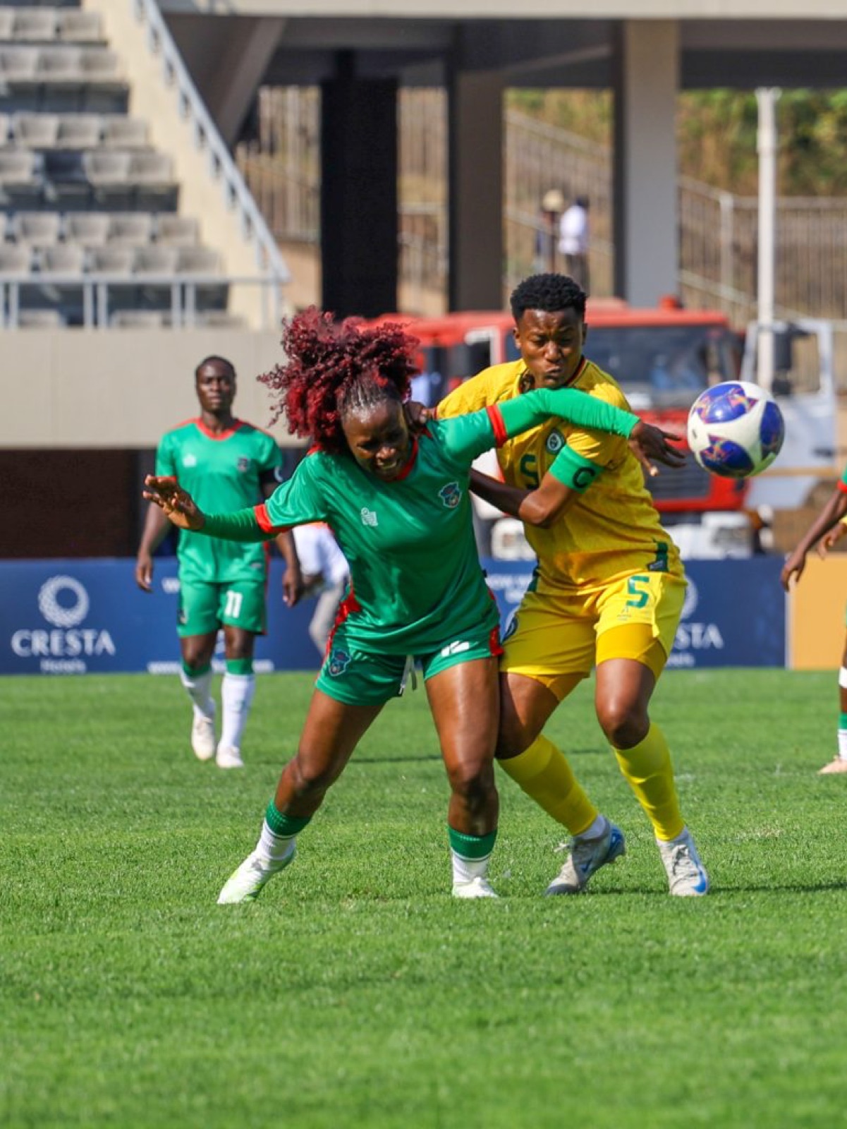 Malawi and Zimbabwe women's players in action during the Olympic qualifier at the National Sports Stadium in Harare